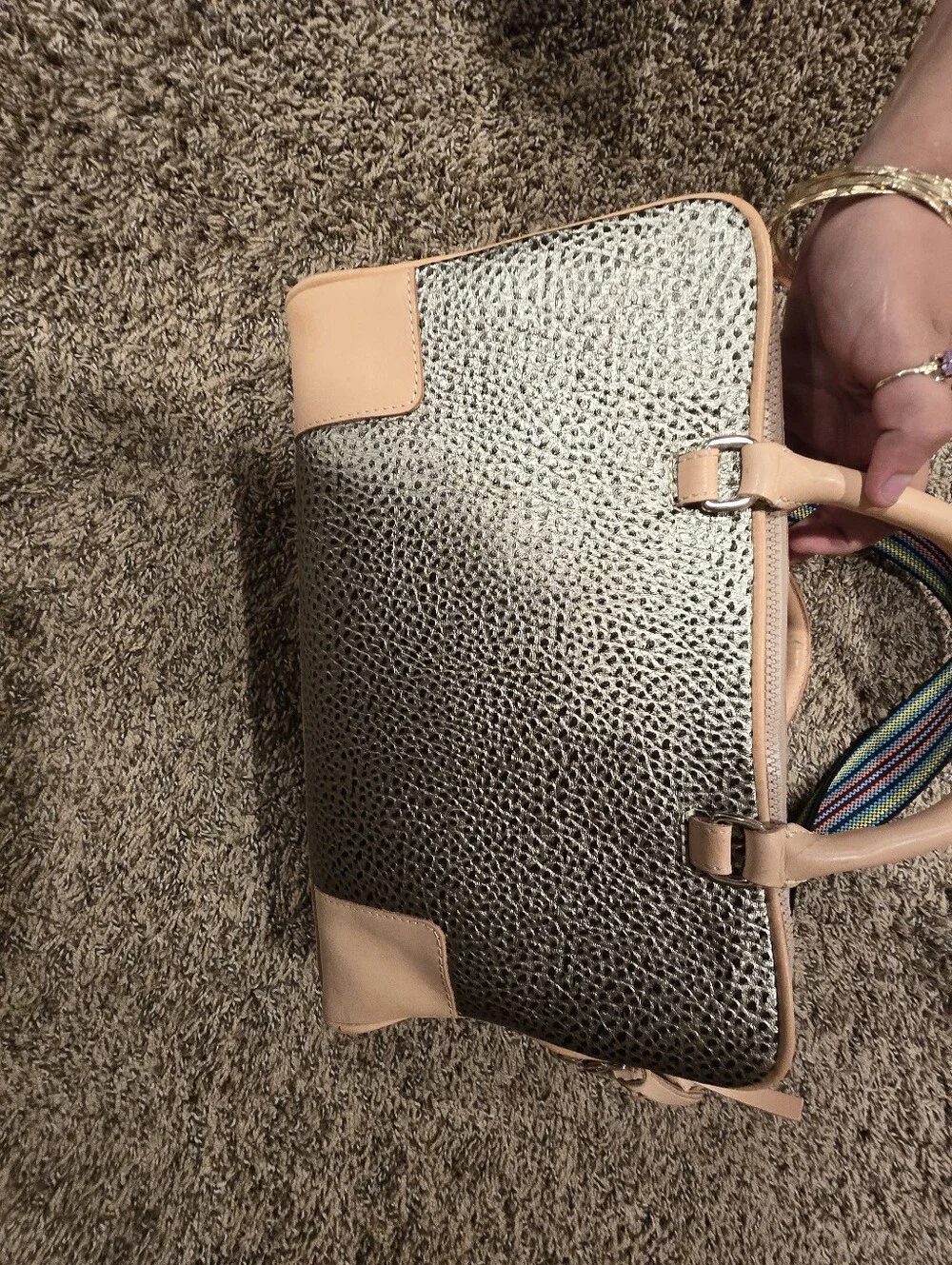 Consuela Tommy Satchel With a textured gold exterior & natural leather handles